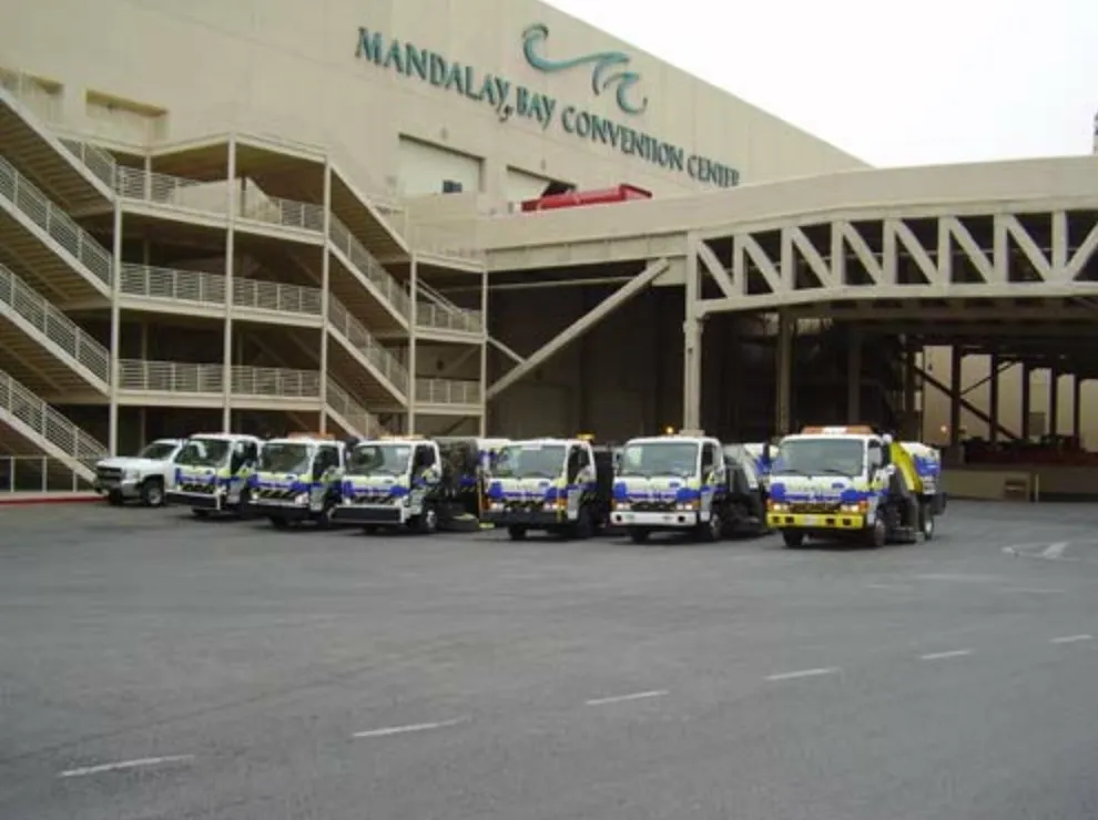 Six Bailey's Sweeper Service trucks lined up outside the Mandalay Bay Convention Center in Las Vegas