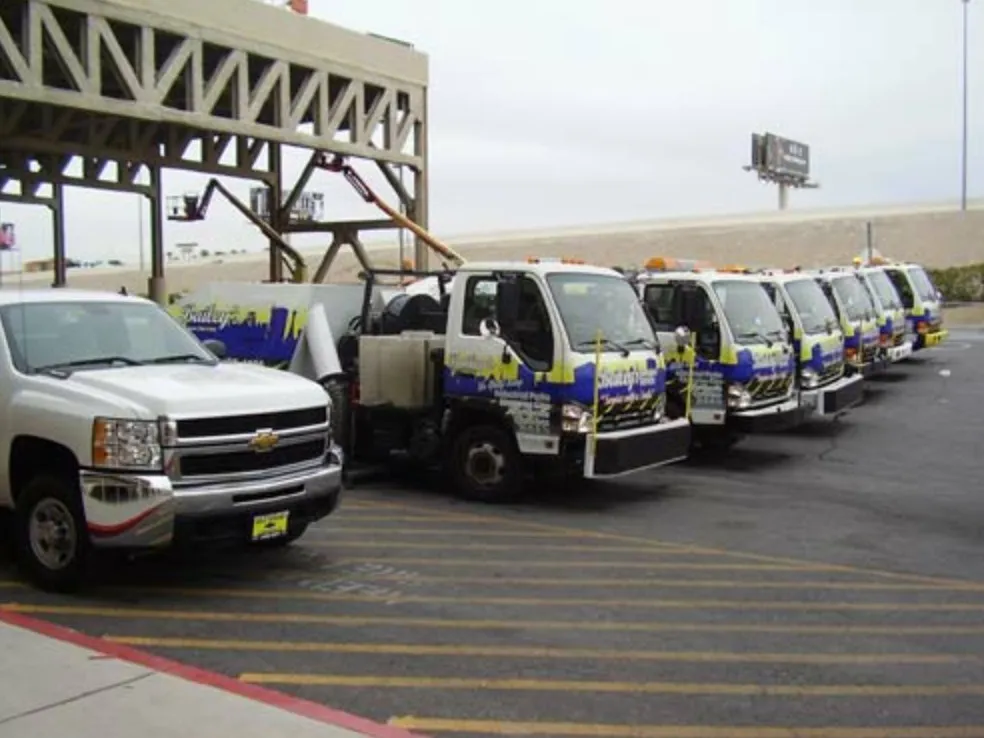 A fleet of Bailey's sweepers and a Chevrolet pickup staged at Las Vegas Motor Speedway